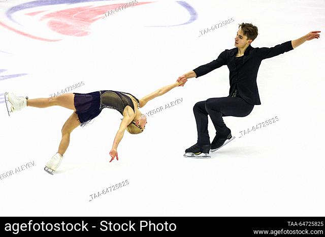 RUSSIA, KAZAN - NOVEMBER 12, 2023: Anastasia Mukhortova and Dmitry Yevgenyev perform a death spiral during the pairs' free skating event at Stage 4 of the...