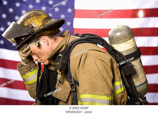 Portrait of a firefighter with US flag