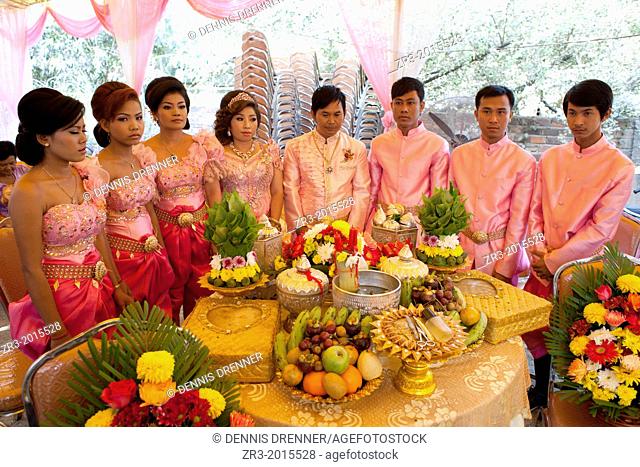The wedding party lines up during a Buddhist wedding ceremony in a small village outside of Phnom Penh, Cambodia