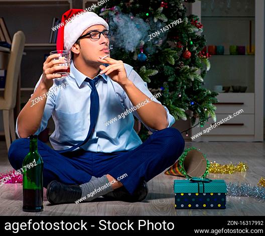 The businessman celebrating christmas at home alone