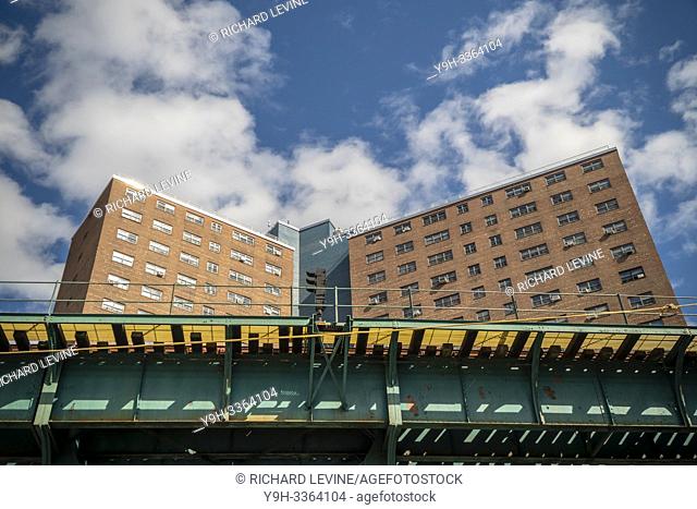 Manhattanville housing project in Harlem in New York with the IRT elevated subway on Saturday, April 27, 2019. (© Richard B. Levine)