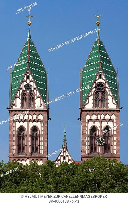 Towers of the Herz Jesu-Kirche, or Sacred Heart Church, built in the style of Historicism, consecrated in 1897, Freiburg, Baden-Württemberg, Germany