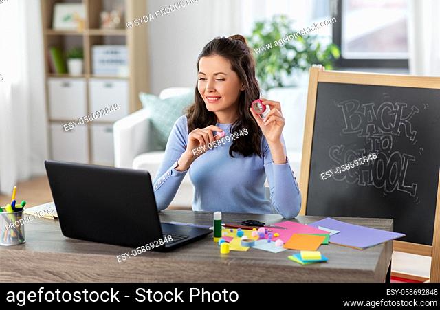 teacher having online class of arts and crafts