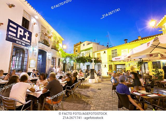 Restaurant terraces at the Port district by night. Denia. Alicante. Valencia Community. Spain