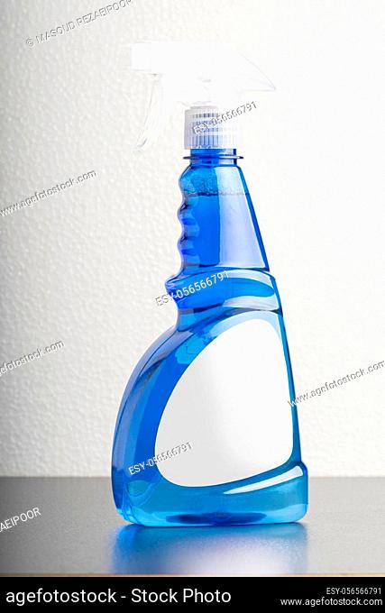 Cleaning liquid bottle in front of light gray background, editable mock-up series template ready for your design, label selection path included