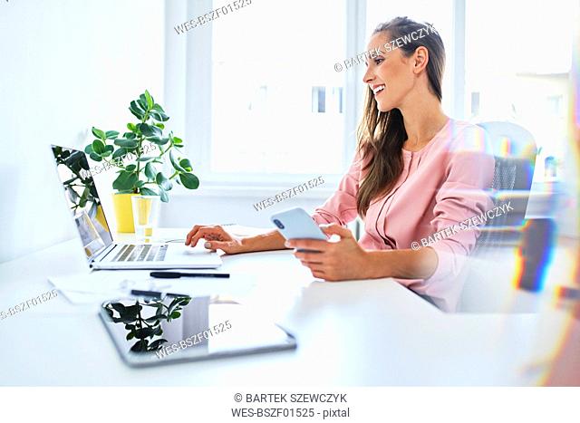 Young businesswoman working on laptop in home office