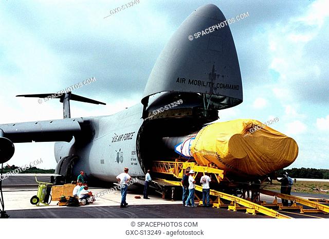 04/06/1999 --- At Cape Canaveral Air Station, workers begin offloading an Atlas IIA rocket from a U.S. Air Force C-5c. The rocket is scheduled to launch the...