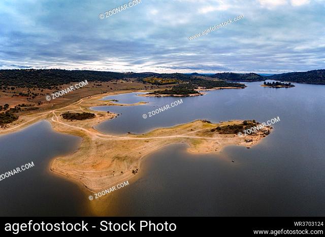 Drone aerial view of Idanha Dam Marechal Carmona landscape with beautiful blue lake water, in Portugal