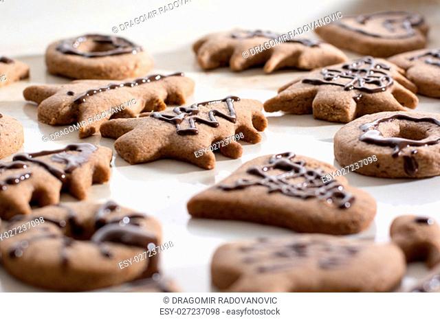 Decoration on gingerbread cookie close up. Baking with children