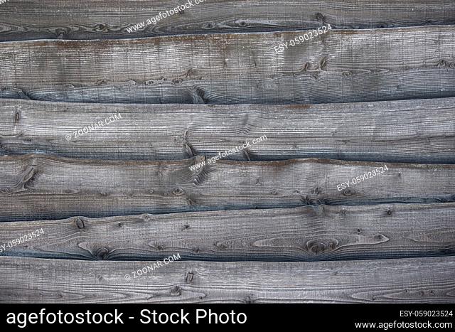 Full frame image of a rustic grey wooden background with horizontal lines with space for copy