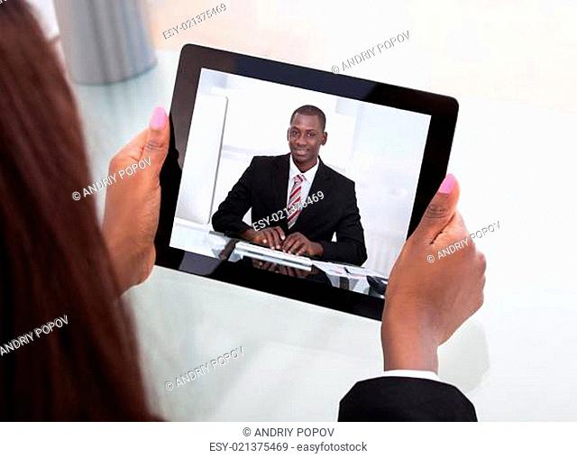Businesswoman Attending Video Conference With Colleague On Digital Tablet