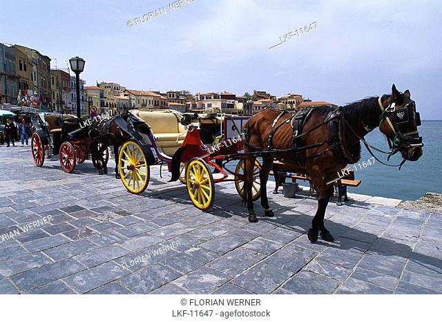 Horse drown carriages at the harbour of Chania, Crete, Greece, Europe