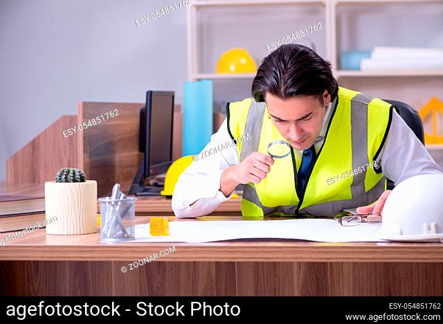 The young male architect working in the office