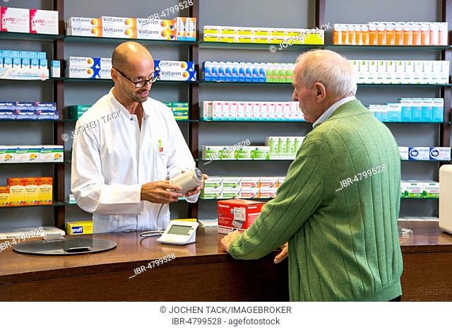 Pharmacy, Pharmacist advises a customer who wants to buy a blood pressure monitor, Germany