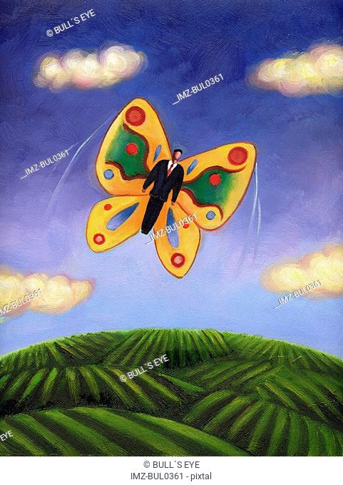 A businessman with butterfly wings flying in the sky