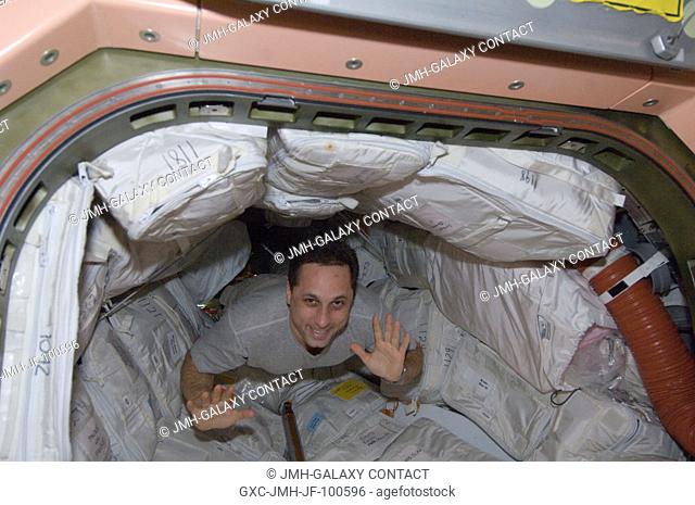 Russian cosmonaut Anton Shkaplerov, Expedition 30 flight engineer, floats through a hatch into the Unity node of the International Space Station