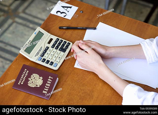 RUSSIA, YEKATERINBURG - MAY 26, 2023: A passport of a Russian citizen and a calculator are pictured ahead of a unified state exam