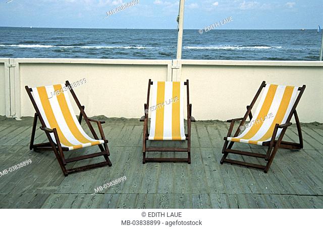 Netherlands, Noordwijk, coast,  Terrace, deck chairs, empty,   North sea, outlook terrace, sandy beach, sun decumbences, sun chairs, yellow-white, abandoned