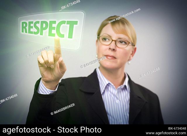 Attractive blonde woman pushing respect button on an interactive touch screen