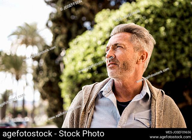 Thoughtful mature man in park