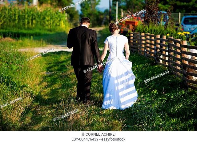 Young married couple walking