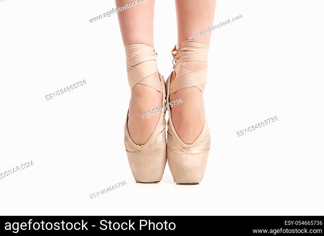 legs in pointe ballerina isolated on white background