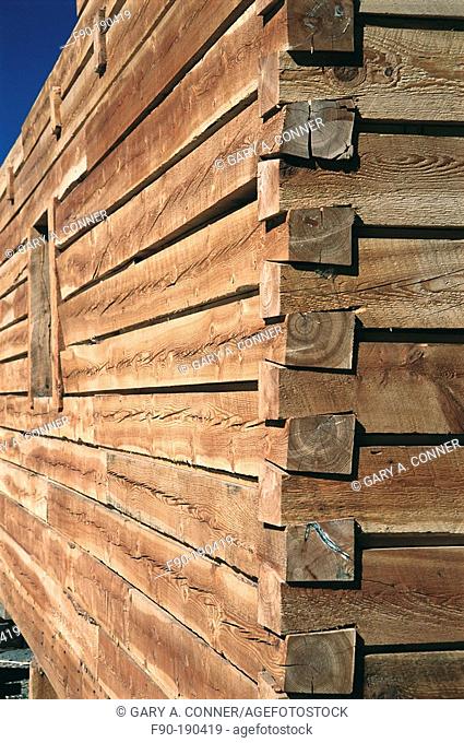 Detail of wall joint of log home under construction. Colorado. USA