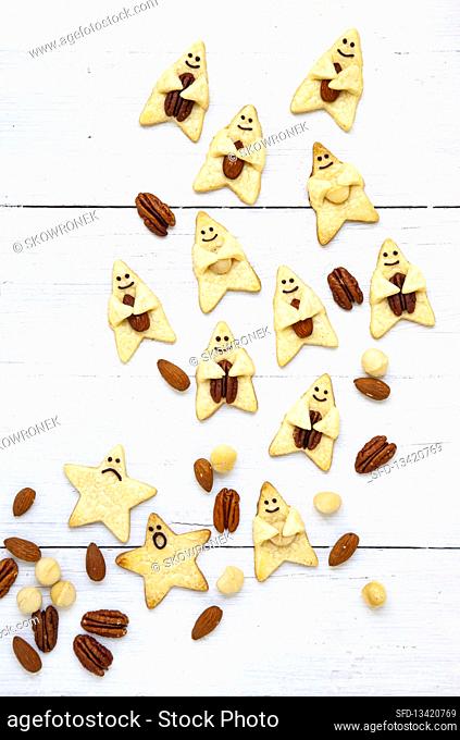Butter biscuits with nuts, decorated with funny faces