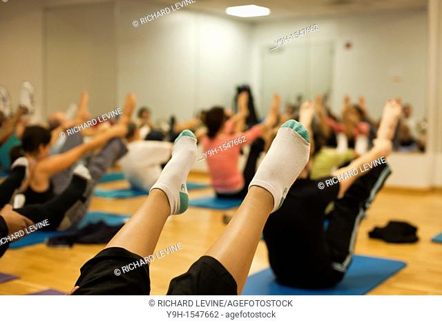 Exercisers participate in a pilates class at the Chelsea Recreation Center in New York