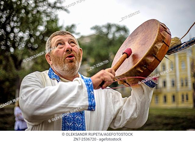 A man bangs a drum as Ukrainian pagans celebrate Radogost, one of the main Slavic holidays, Kiev, Ukraine