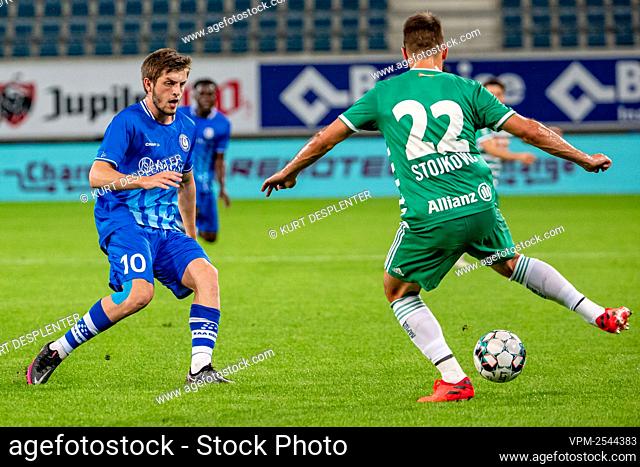 Rapid Wien's Thomas Murg and Gent's Sulayman Marreh fight for the ball during a game between Belgian soccer club KAA Gent and Austrian club Rapid Wien