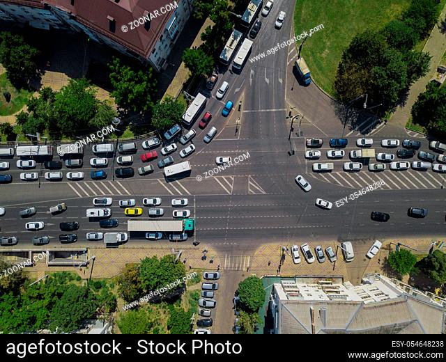 Abstract overhead aerial view of traffic driving navigating through busy street