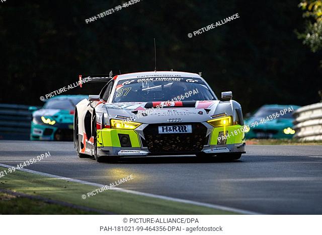 20 October 2018, Rhineland-Palatinate, Nuerburg: The Audi R8 LMS with Peter Schmidt and Christopher Haase from Team Car Collection Motorsport is driving in the...