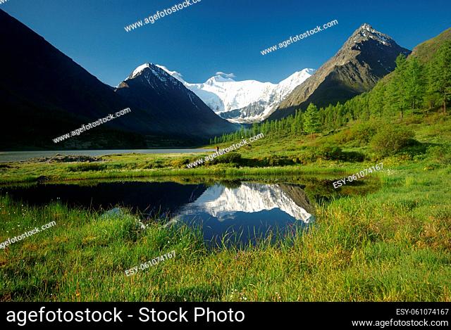 Beautiful mountain landscape near the lake. Mountain Lake. Kind of mountainous terrain and the water in the valley