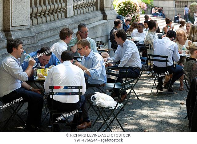 Visitors to Bryant Park in New York enjoy their lunch hours