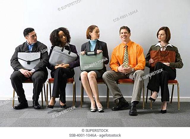 Business executives sitting in a waiting room