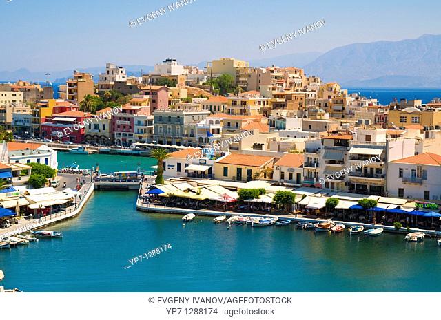 Lake Voulismeni with bridge and houses in Agios Nikolaos, Crete