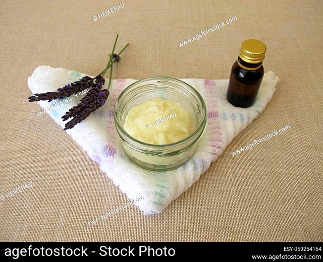 Homemade deodorant with essential lavender oil in a glass jar