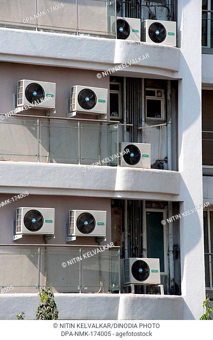 Pumps of air condition kept at external wall of building ; Bombay Mumbai ; Maharashtra ; India 2010