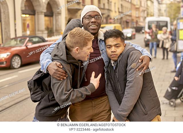 young men in city, in Munich, Germany