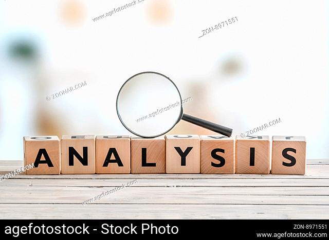Analysis with a magnifying glass on wooden cubes