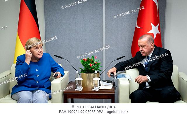 23 September 2019, US, New York: Federal Chancellor Angela Merkel (CDU) meets Recep Tayyip Erdogan, President of Turkey, on the sidelines of the UN climate...