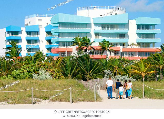 Manmade protective dunes and condominium buildings in background. Atlantic Shore. South Beach. Miami Beach. Florida. USA