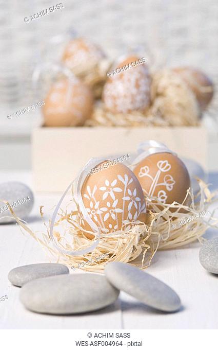 Painted Easter eggs in straw nest