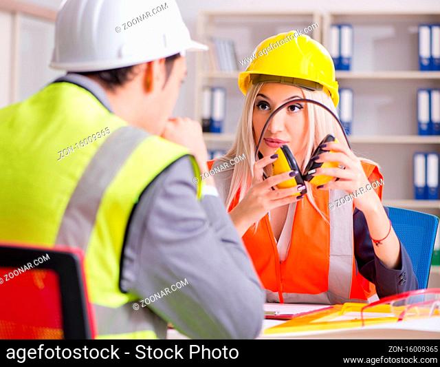Construction workers having discussion in office before starting project