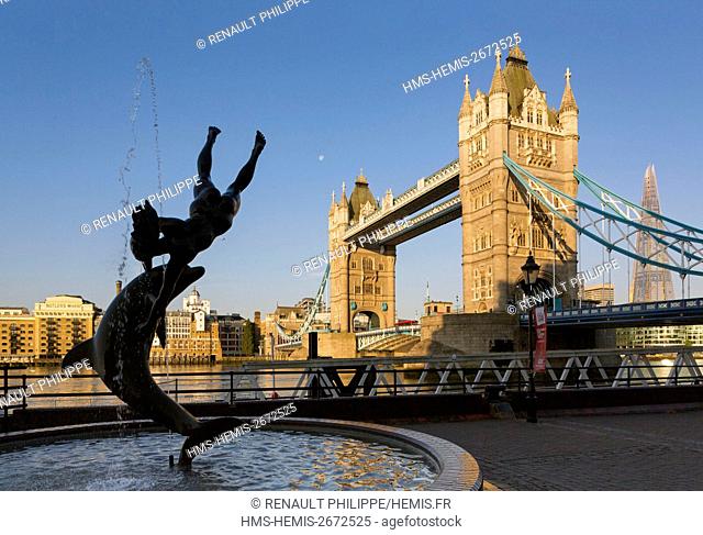 United Kingdom, London, Tower Bridge, Girl with a dolphin statue by David Wynneat in the background the Tower The Shard by architect Renzo Piano
