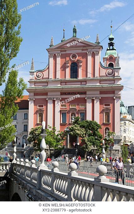 Ljubljana, Slovenia. Presernov trg (or square) and the Baroque Franciscan Church of the Annunciation seen across the Tromostovje, or Triple Bridge