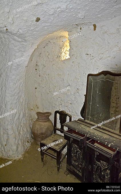 Old dressing table with mirror and chair in cave house, Calguerin, Cuevas del Almanzora, Andalusia, Spain, Europe