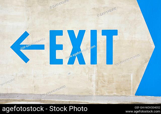 Large Exit Sign painted in Blue on White Wall