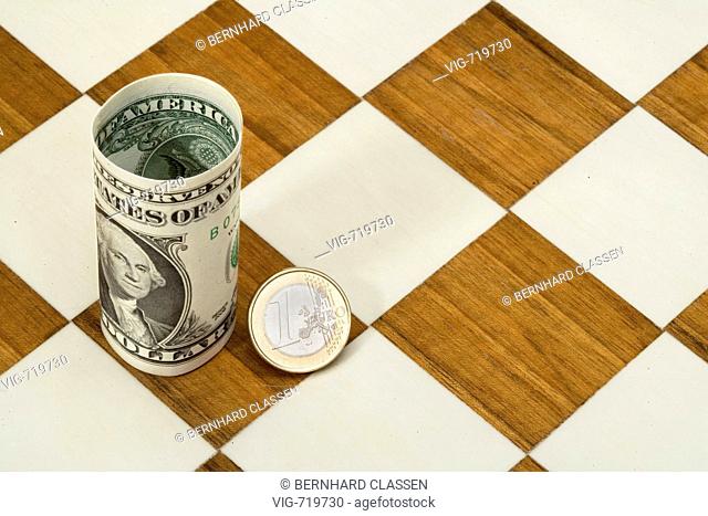 1 Euro coin and 1 Dollar banknote on chessboard. - 07/04/2008
